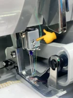 Needle screw for Singer 14U overlock sewing machine, metal replacement part for secure needle fastening.